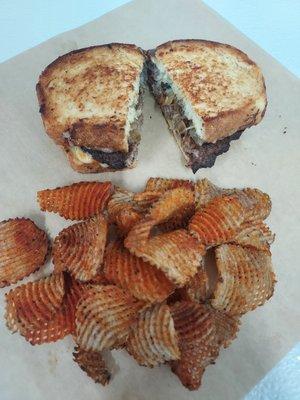 Texas Toast Patty melt with waffle cut potatoes chips seasoned with our own seasoning