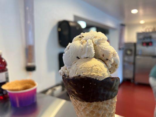 Chocolate chip cookie dough in a dipped waffle cone