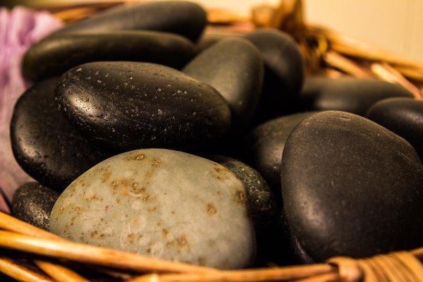 Warm up and relax your tired,  sore muscles with a Hot Stone Massage.   These are the actual river rocks I use for this treatment.