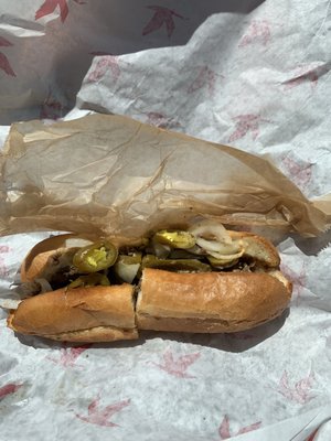 Cheesesteak hoagie with Swiss cheese and jalapeño peppers