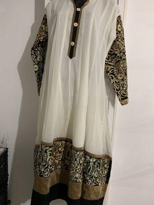 White chiffon dress embroidered in black and gold  $69.99