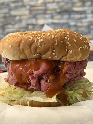 Large beef with lettuce, tomatoes, onion, cheese, mayo and sauce.