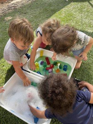 Sensory bins with blocks for the toddler class!  Play, learning, and getting messy is fun!