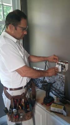 Gotto Electric installing new GFCI protected outlets in a kitchen remodel as per National Electric Code