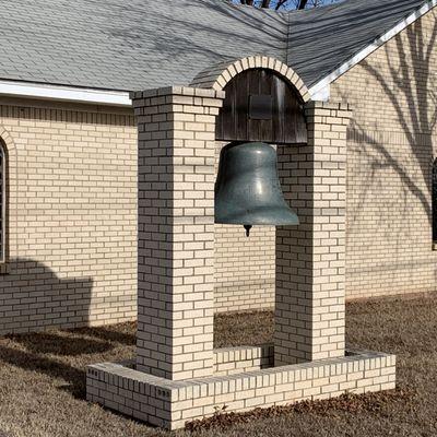 Bell in front of the Holy Cross Greek Orthodox Church.