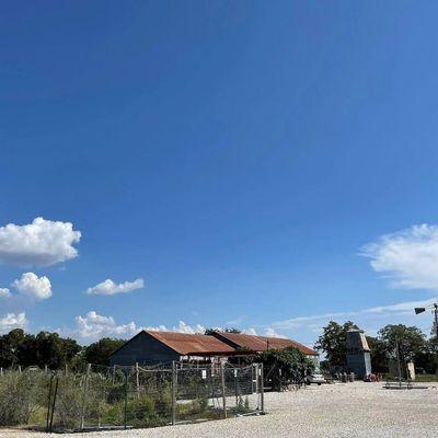 The winery's rusty tin roof under the Texas sky