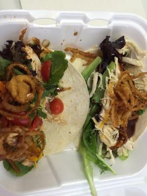 Teriyaki chicken taco with fresh spring mixed greens and fried onions on top.