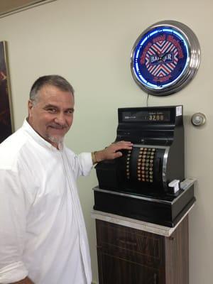 Dennis the owner/barber. I love this 80 year old register. It still works!