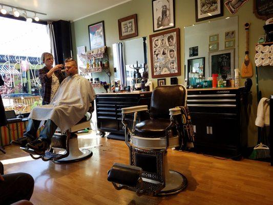 Old school Barber Shop is what makes this place great!  Grab a beer out of the fridge, sit down and make yourself comfortable!  Good times!