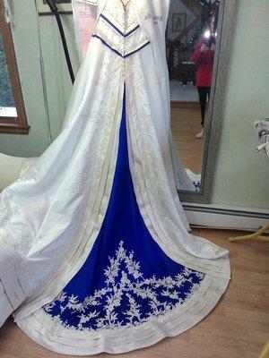 Bridal gown alteration by Mollie Frish. The dress wa previously all ivory.. The bride wanted Royal Blue added