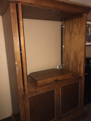 Empty entertainment center (the rooms are pictured with flat screen TV's)