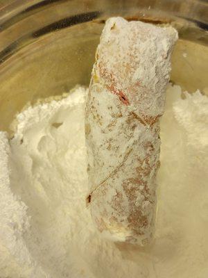 Strawberry cheese cake dipped in powder sugar