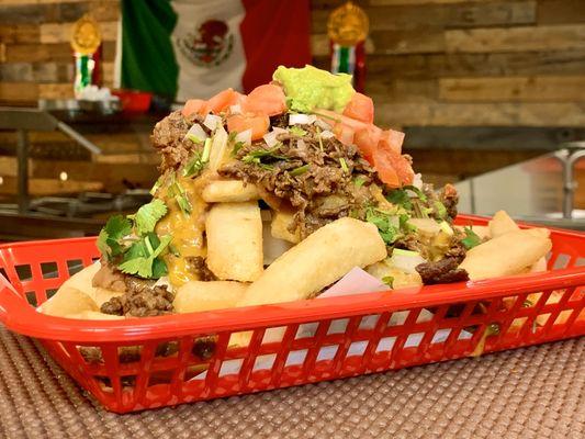 Carne Asada Fries. Loaded with slow-cooked beans, cheese, sour cream and guac.