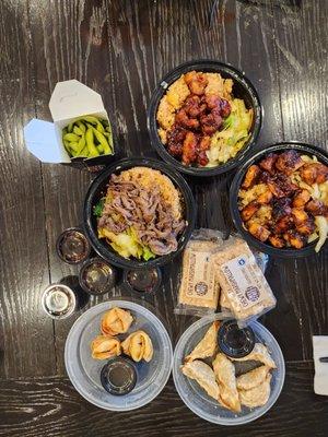 From the top, going clockwise, orange chicken, mad chicken, Rice Krispy Treats, pot stickers, crab Rangoon, steak bowl and edamame.