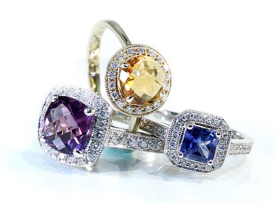 Love Halos? So do we! Especially with colored gemstones! These three photographed here are absolutely stunning. Come in and see!