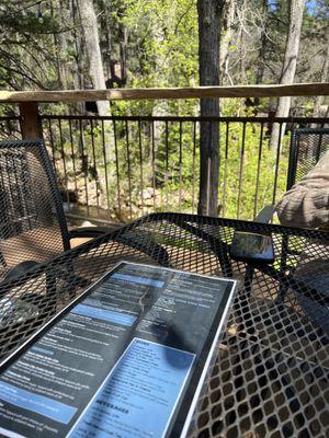 Table on deck by the creek