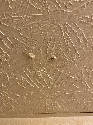 Nails coming out of the ceiling.