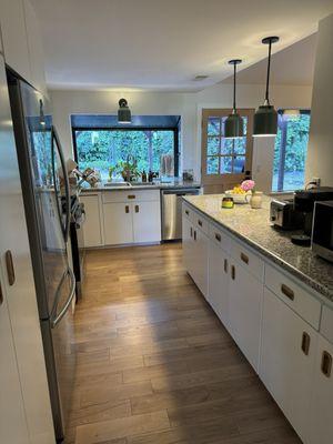 After of the kitchen. We didn't do a renovation, just some tweaks to spruce it up. No more dated ceiling lights, cabinets or weird walls!