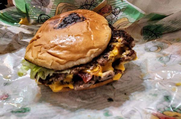 Bacon double burger with lettuce, tomato, mayo, and mustard