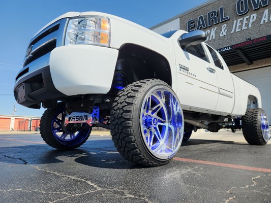 Chevy with custom suspension lift kit.