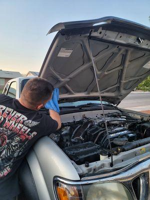 Cleaning engine bay.