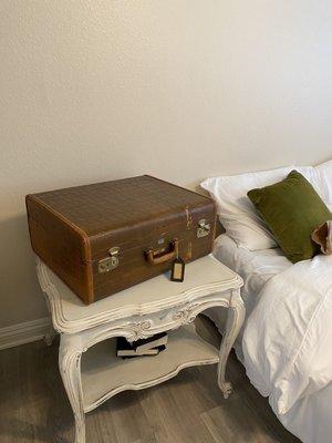 Vintage luggage I use to store clothes that don't go on a hanger as well as decor