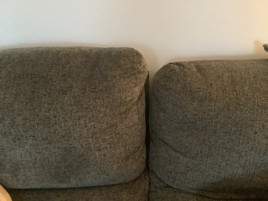 Back of loveseat that sticks up. Won't stay attached.