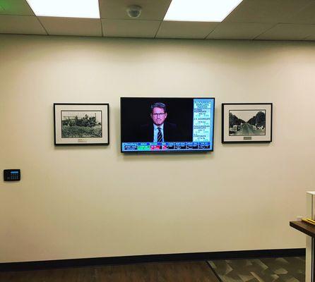 50" HDTV mounted in a office entry way.