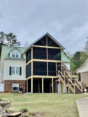 Premium multi level screen porch with composite decking, screeneze screen system and western red cedar