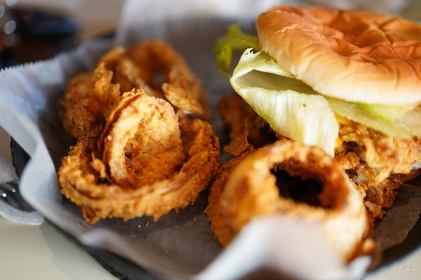 Chicken-fried steak sandwich w/ onion rings