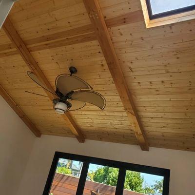 Master bedroom remodel. La cantina doors installed and real wood beam ceiling installed by us.