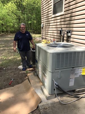 One of our employees and a unit we installed.