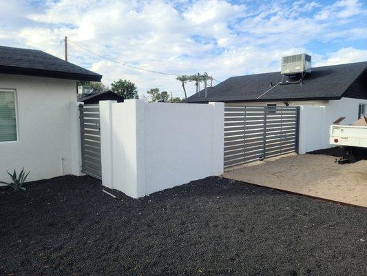 4x8x16 fence block with sand finish stucco and custom gates.