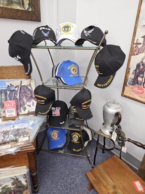 Military caps have arrived in Knotty Korners booth.