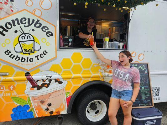 Teenagers excited to be serving and receiving boba!