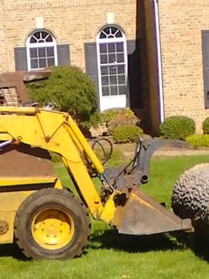 Along with our innovative crew the skidsteer comes in handy on many jobs.