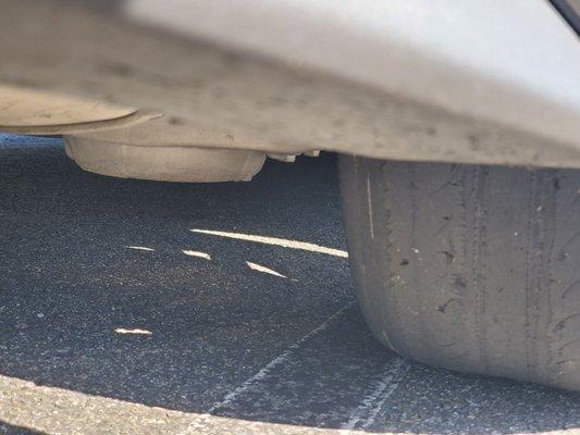 Tred and small holes in back passenger tire that the manager could have cared less about.