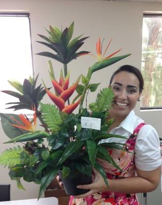 Bianca, our decorator holding BD0012 arrangement.