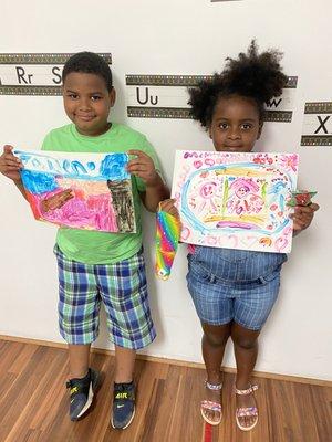 First graders showing off their art.