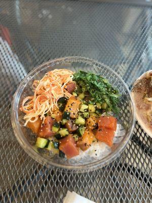 Custom poke bowl with crab, seaweed salad, cucumber, tuna, salmon.