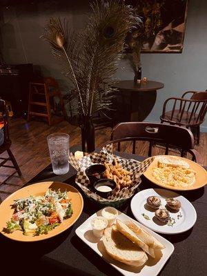 In house baked bread, mushrooms, house salad, French fries, mushrooms Mac n cheese.