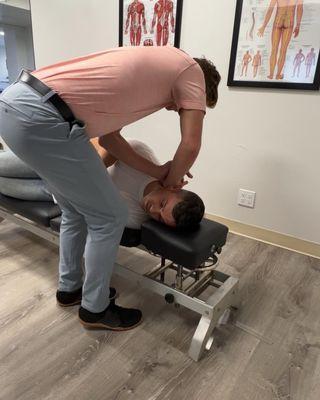 Upper cervical adjustment with a drop table