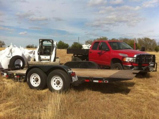 Bobcat and Trailer for Material Delivery.