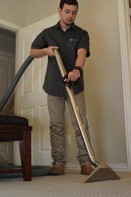 Extracting water from a flooded carpet