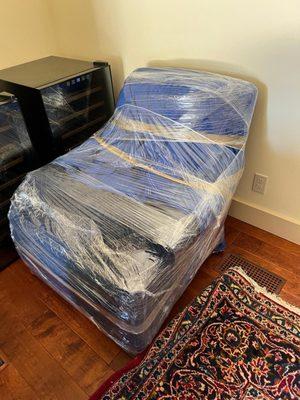 We wrap the furniture in moving blankets and then wrap them in heavy-duty shrink film to ensure they don't get damaged during transportation