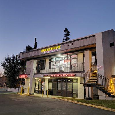 backlit glow of outdoor sign Revive Aesthetics OC