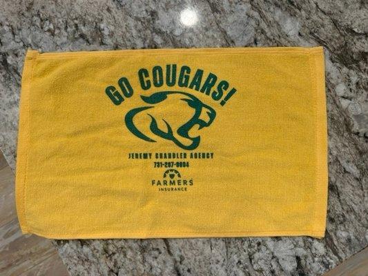 JCM Cougars spirit towels by Farmers Insurance.