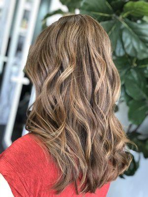 Highlights, lowlights and grey coverage for a seamless blend. Long layers to finish off the fresh look.