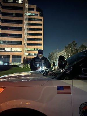 Patrol officer updating his route sheet on patrol