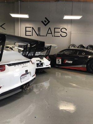 Two Porsche GT3 cup cars an R8 LMS